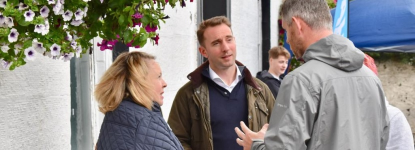 Luke with local people